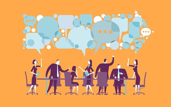 A graphical representation of a group of working people are in discussion with each other, communication symbols placed above them.